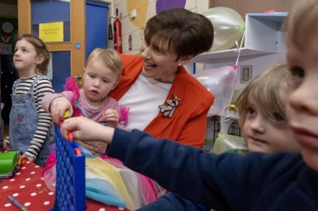 Minister for Children, Disability and Equality Norma Foley with Avril Lynch, alongside children from Coiste Áiseanna na nÓige Family Resource Centre