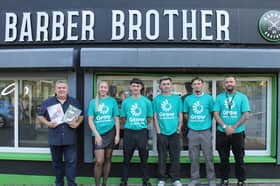 Paul Gibson, Amy Carlin, Daniel O'Hagan, Lukas Lynch, Shea Whyte, and Philip Whyte outside the barber shop
