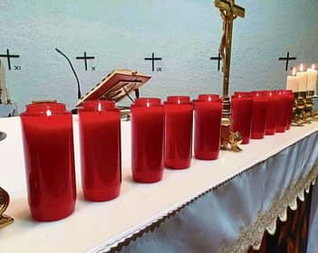 Ten candles lit at St Michael's Church, remembering each life lost