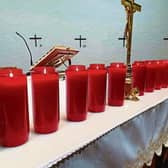 Ten candles lit at St Michael's Church, remembering each life lost