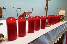 Ten candles lit at St Michael's Church, remembering each life lost