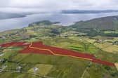 The 27.3-acre farmland at Linsfort, overlooking Lough Swilly, is being offered for sale by Franklins Estate Agents with an asking price of €370,000.