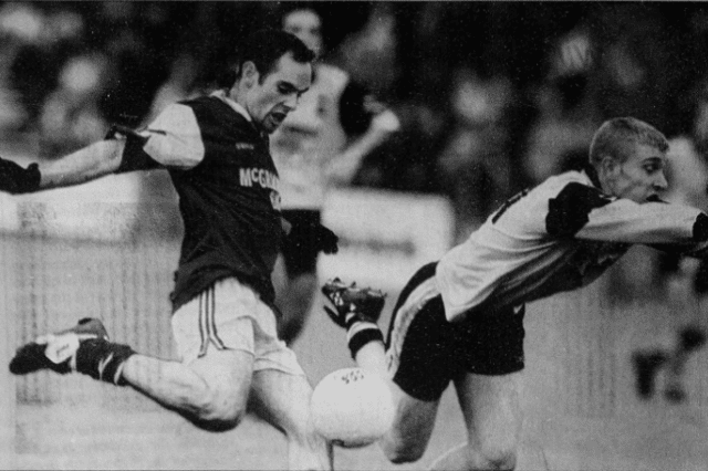 Conall Dunne gets a block in on this Joel Carr effort