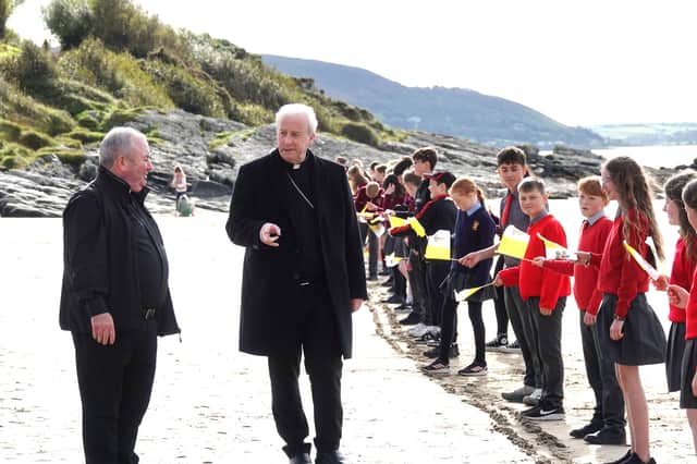 School children greet the Bishop and Fr Bradley.