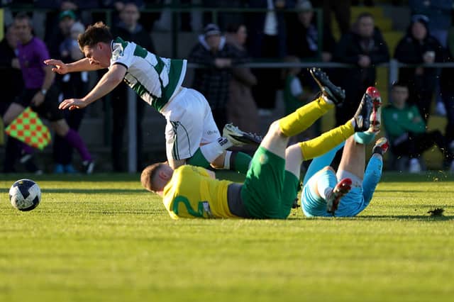 Cockhill Celtic's Luke Rudden is taken down in the penalty box by Bonagee United's goalkeeper Andrew Nicholls and Ciarn Kelly during the FAI National League at Dry Arch Park, Letterkenny