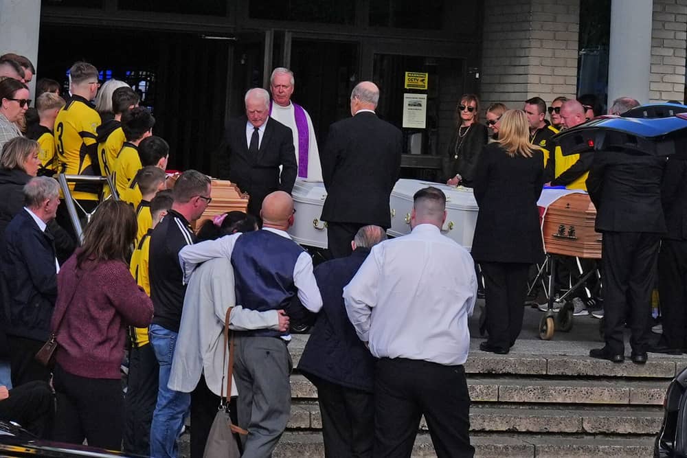 The four coffins of Philip and Kim English and their sons, Jayden and Callum, are carried into Sacred Heart Church Parish Centre in Waterford on Sunday