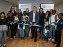 Dr. Niall Muldoon, Ireland’s Ombudsman for Children, cutting the ribbon at the official launch of the new POD Play Hub at the IPAS centre in Westside Apartments, Letterkenny.