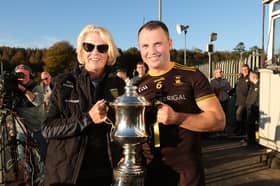 Donegal GAA Chairperson Mary Coughlan and St Eunan's captain Conor O'Donnell holding the Dr Maguire Cup