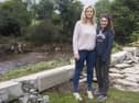 Ciara O'Neill and Molly Dunlop pictured at the back of their flooded Elm Park home in 2017, when the retaining wall collapsed after the nearby Crana River burst its banks. Homes in the Buncrana estate face the dual scourge of mica and flooding.