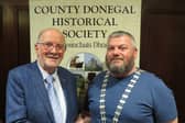 Joe Gatins, outgoing President of the Country Donegal Historical Society congratulating the new incoming President Michael Meehan