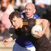 St. Eunan's Shane O'Donnell breaks away from Naomh Conaill's John O'Malley during the Senior Football Championship final in MacCumhaill Park