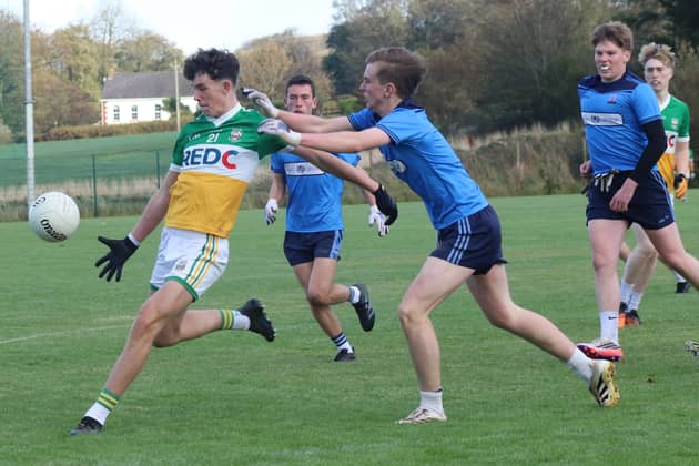 Tiernan McGonagle get a shot away for Buncrana