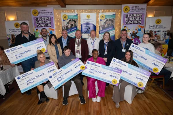 From left: winners Geraldine Wood, representing Rebecca Wood, Peadar Doherty, Prisca Mamadi, and Alicia McCullagh.  Back from left: Enda Slevin, representing Sienna Slevin, Gavin Callaghan, Paula Logan, Robert Brennan, Paddy Duffy,  Paul Brolly,  Sinead Crawford, Kieran Friel, and Mia Shiels,
