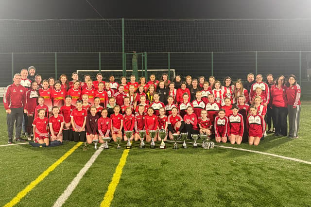 Cappry Rovers coaches and players celebrate with their trophy haul at Cappry Park on Thursday evening