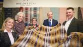 Miche&aacute;l Martin gets a grip of some Donegal tweed thanks to Molly & Sons from Ardara