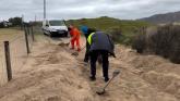 Watch: Some hard graft needed to clear road in Inishowen following sand storm