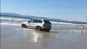 Number of cars caught  in incoming tide at famous Donegal beach
