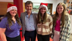 Girls wear Christmas hats to celebrate Daniel's return to the stage