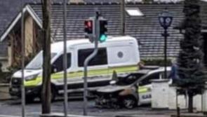 Man due in court after patrol car set on fire