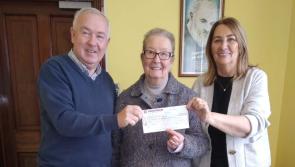 Mollie Harkin makes a donation to The Alzheimer Society of Ireland
