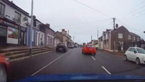National: Watch terrifying moment 'maniac' driver nearly collides with cyclist before running red light