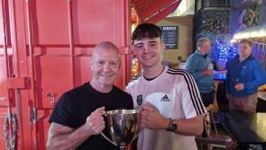 Iarlaith Duffy lifts the Donegal Youth League trophy named after his late grandad 