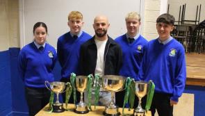 Scoil Mhuire Buncrana welcomes Mark Coyle back with Premier Division trophy