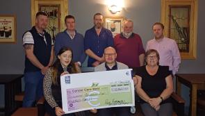 Ardara's 'Poor Farmers’ hand over three cheques to charity at Teague's Bar  