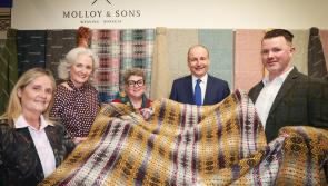 Miche&aacute;l Martin gets a grip of some Donegal tweed thanks to Molloy & Sons from Ardara