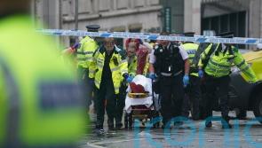 Man detained after car collides with pedestrians during Premier League parade