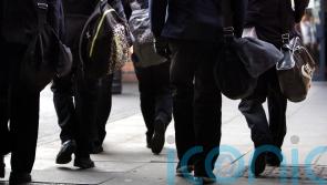 School secretaries and caretakers begin indefinite strike