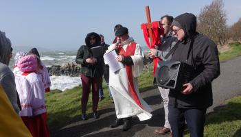 Large crowd attends annual Easter procession along blustery Buncrana coastline