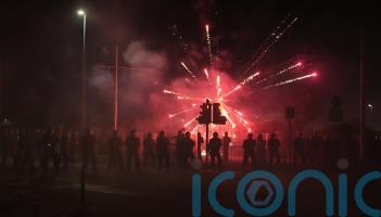 Fireworks and stones thrown at police for second night at asylum seeker hotel