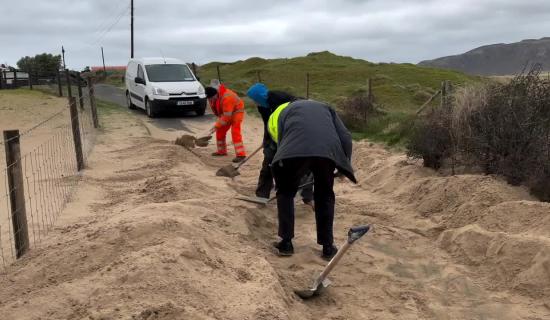 Watch: Some hard graft needed to clear road in Inishowen following sand storm
