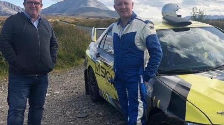John Toal gets into the co-driver's seat with rally stalwart Gavin Kelly under the shadow of Errigal mountain tonight