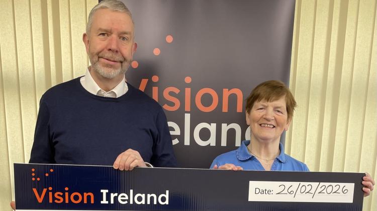Quigley&rsquo;s point woman Bridie generously presents &euro;1,270 to Vision Ireland charity