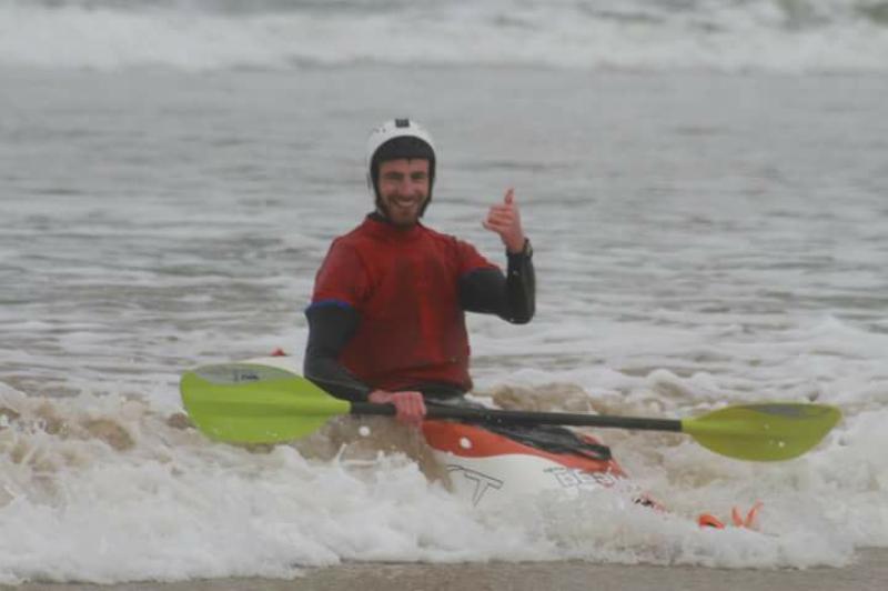 Donegal surf kayaker on the crest of a wave at world championships
