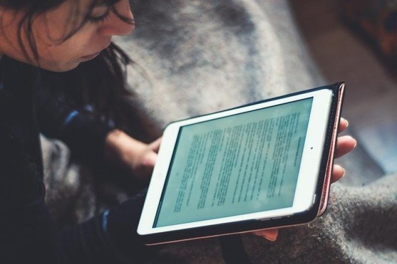 Person reading tablet