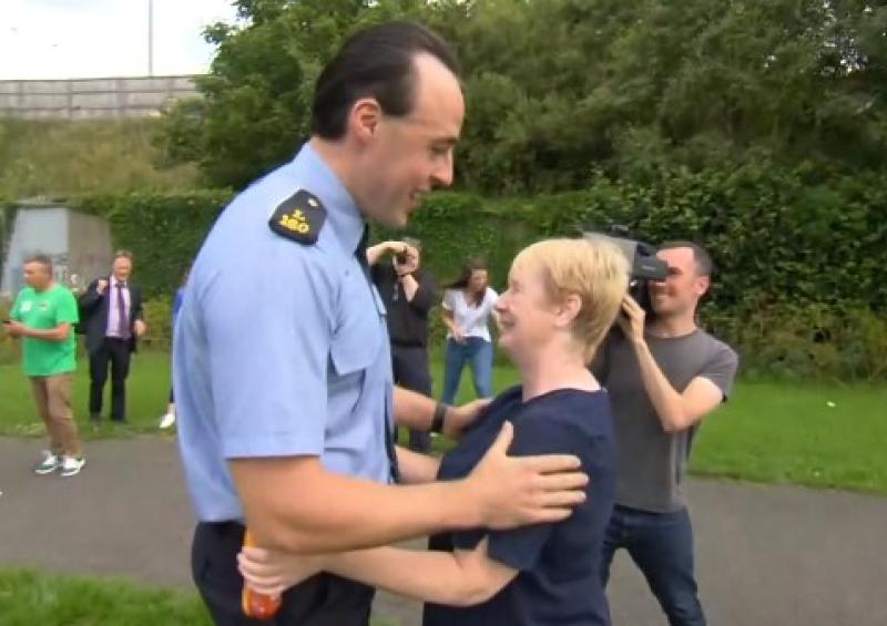Garda Ciaran Murray is reunited with Ann Lam, the woman he rescued from a flooded river