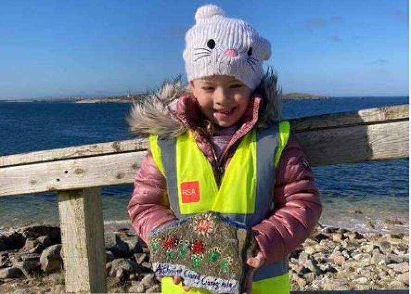 Club leaders inspire children to paint positive messages on shore rocks 