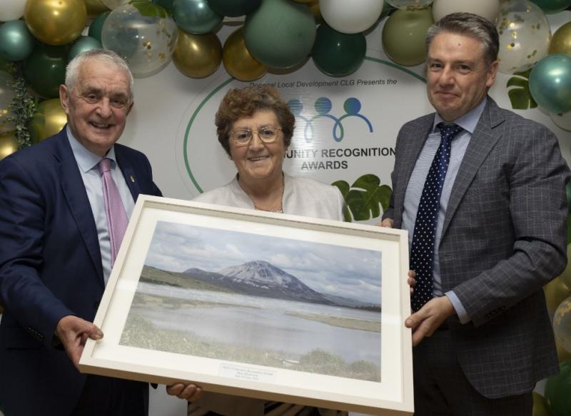 Surprise award to Mary McGowan for outstanding contribution to community 