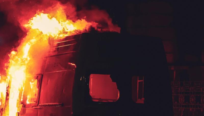 Van burnt out behind owner's house