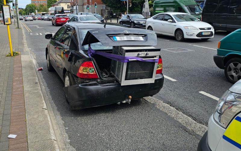 National: Phone-using driver with oven hanging out of the boot has car seized