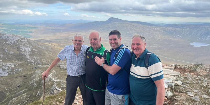 New heights:  Naomh Conaill manager Martin Regan joined by Glenswilly stalwarts on Errigal climb