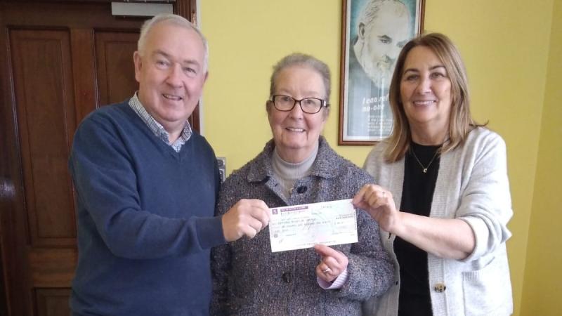 Mollie Harkin makes a donation to The Alzheimer Society of Ireland