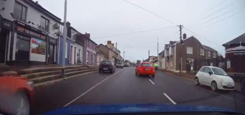 National: Watch terrifying moment 'maniac' driver nearly collides with cyclist before running red light