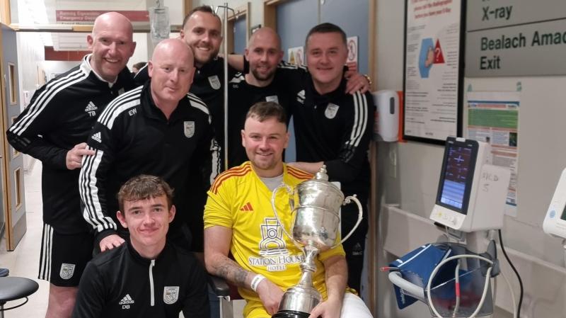 Letterkenny Rovers 'keeper gets his hands on the cup following leg break in final