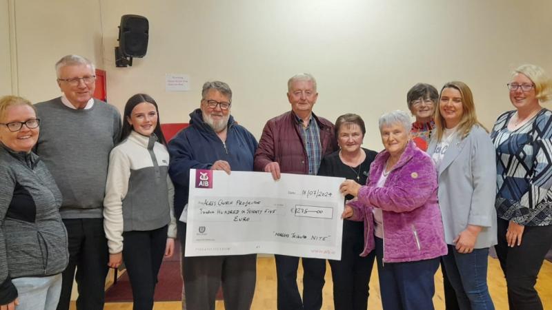 Cheques presented from fundraisers at night in memory of the late Noreen McGarvey