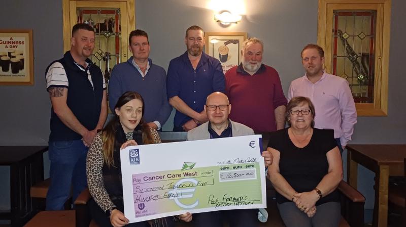 Ardara's 'Poor Farmers’ hand over three cheques to charity at Teague's Bar  