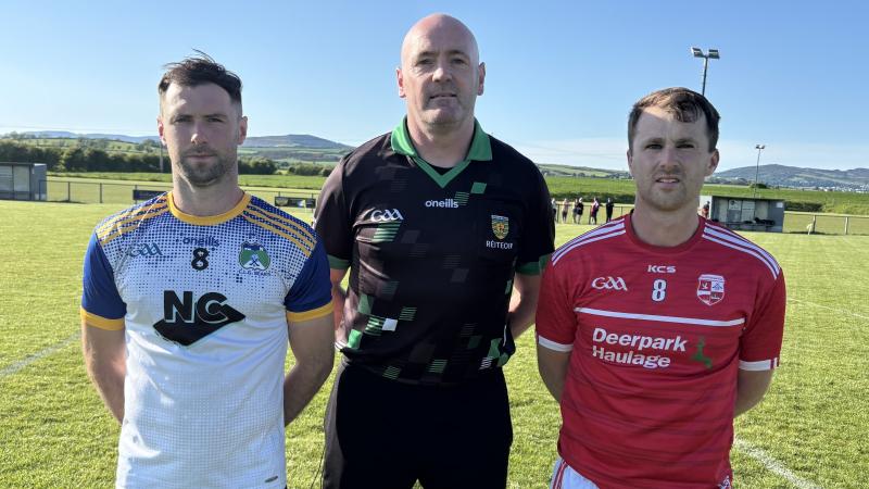 Team captains Stephen O'Donnell and Michael Friel with referee Stephen Doherty